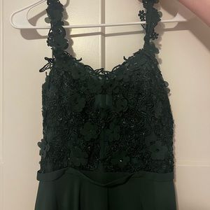 Dark green prom dress, size 4. Slit for leg, train on back, long skirt length